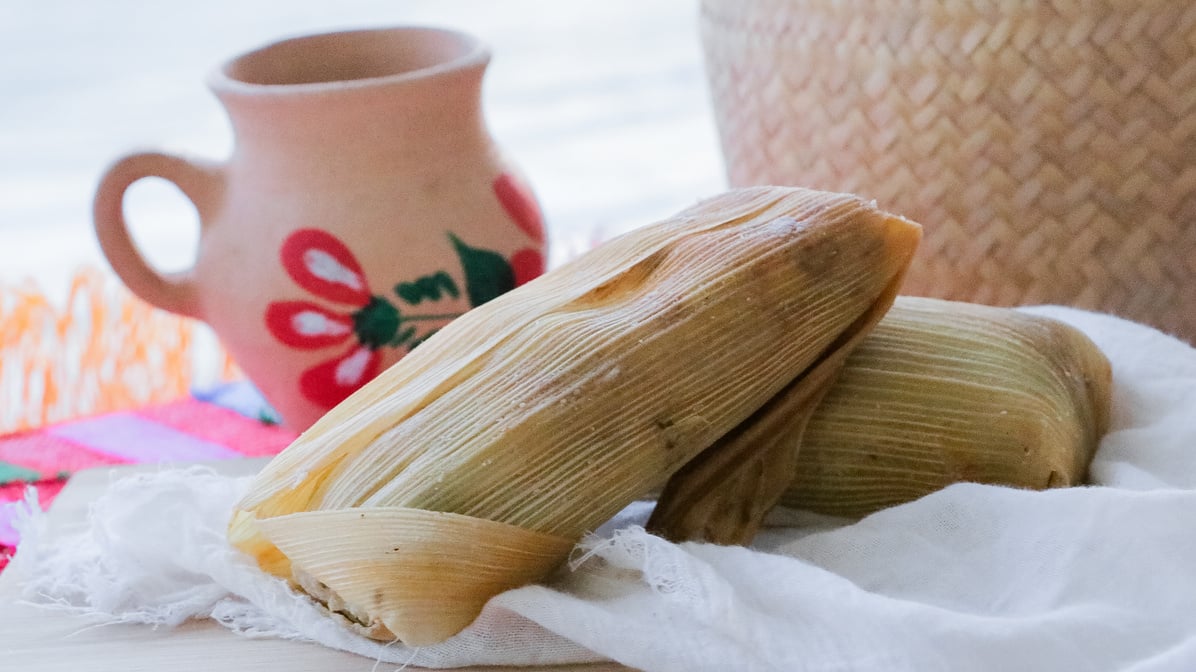 Tamales On White Napkin Mexican Jug